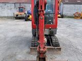 an image of a construction vehicle parked in a parking lot