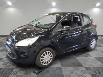 a picture of a small black car parked in a garage