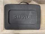 a black box with the word shure written on it