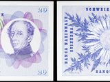 two different pictures of a currency note with a butterfly on it