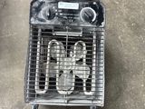 a cage that has a bunch of items inside of it