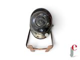 a small metal object on a white surface