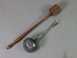 a spoon with a wooden handle next to a spoon with a wooden handle