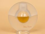 an image of a bottle of perfume on a table