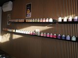 many candles on the shelves in the room