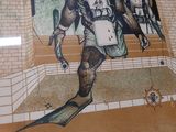 a picture of a picture of a man in a diving suit