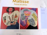 a picture of a book with two paintings on it