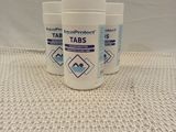 three bottles of tabs sitting on top of a table