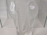 a glass vase with an elephant inside of it