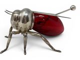 a bug that is sitting on top of a red object