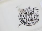a close up of a plate with a stamp on it