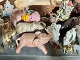 a lot of stuffed animals that are on a shelf