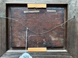 a picture of a picture hanging on a wooden frame
