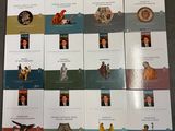 a lot of books on the table with pictures on them