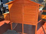 a chicken coop in the middle of a room