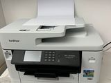 a printer that is sitting on top of a desk