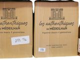 bottles of wine and a box of wine are sitting on a table