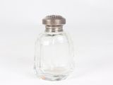 a salt shaker with a silver top on a white background