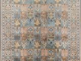 a blue and beige rug with a floral design