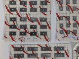 four pieces of paper with blood on them on a table