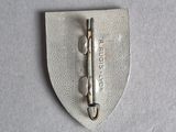 a close up of a metal pin on a white surface