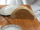 a wooden table with two plates and a plate holder on it