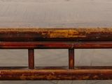 a close up of a wooden bench with rust on it