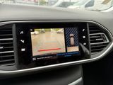 the dashboard of a car with a camera mounted to it ' s dashboard