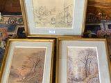 three framed pictures of trees and a house on a rug