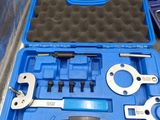 a blue case with tools in it sitting on the floor