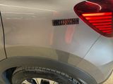 a close up of a car ' s rear end with a sticker on it