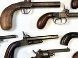 a lot of old guns that are on the table