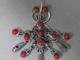 silver broochle with red corals and blue glass beads