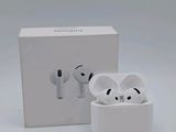 a white box with a pair of airpods sitting next to it