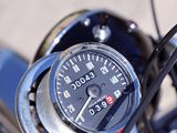 a close up of a speedometer on the handlebar of a motorcycle