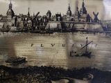 a picture of a picture of a city on the wall