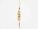 an image of a gold plated watch with a chain attached to it