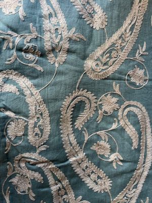 a close up of a piece of fabric with a paisley design on it