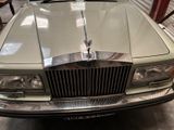a picture of a car with a hood ornament on it