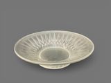 an image of a glass bowl on a gray surface