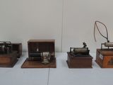three small machines sitting on top of a table next to each other