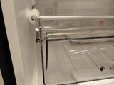 an open refrigerator with the door open showing the inside of it
