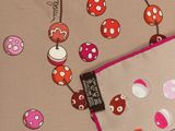 a picture of a fabric with a pattern of mushrooms on it