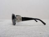 chanel sunglasses with black frame and silver logo on the side
