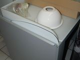 a white refrigerator and a white dishwasher in a kitchen
