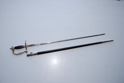 two swords on a table with a chain around them