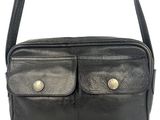 a black leather shoulder bag with two compartments on the front