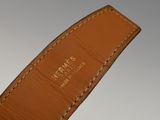 a close up of a brown leather watch strap with white stitching