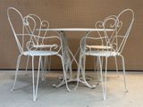 three chairs and a table on the concrete floor