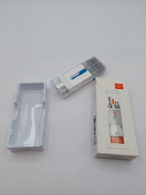 a box of toothbrushes and a box of toothpaste on a table